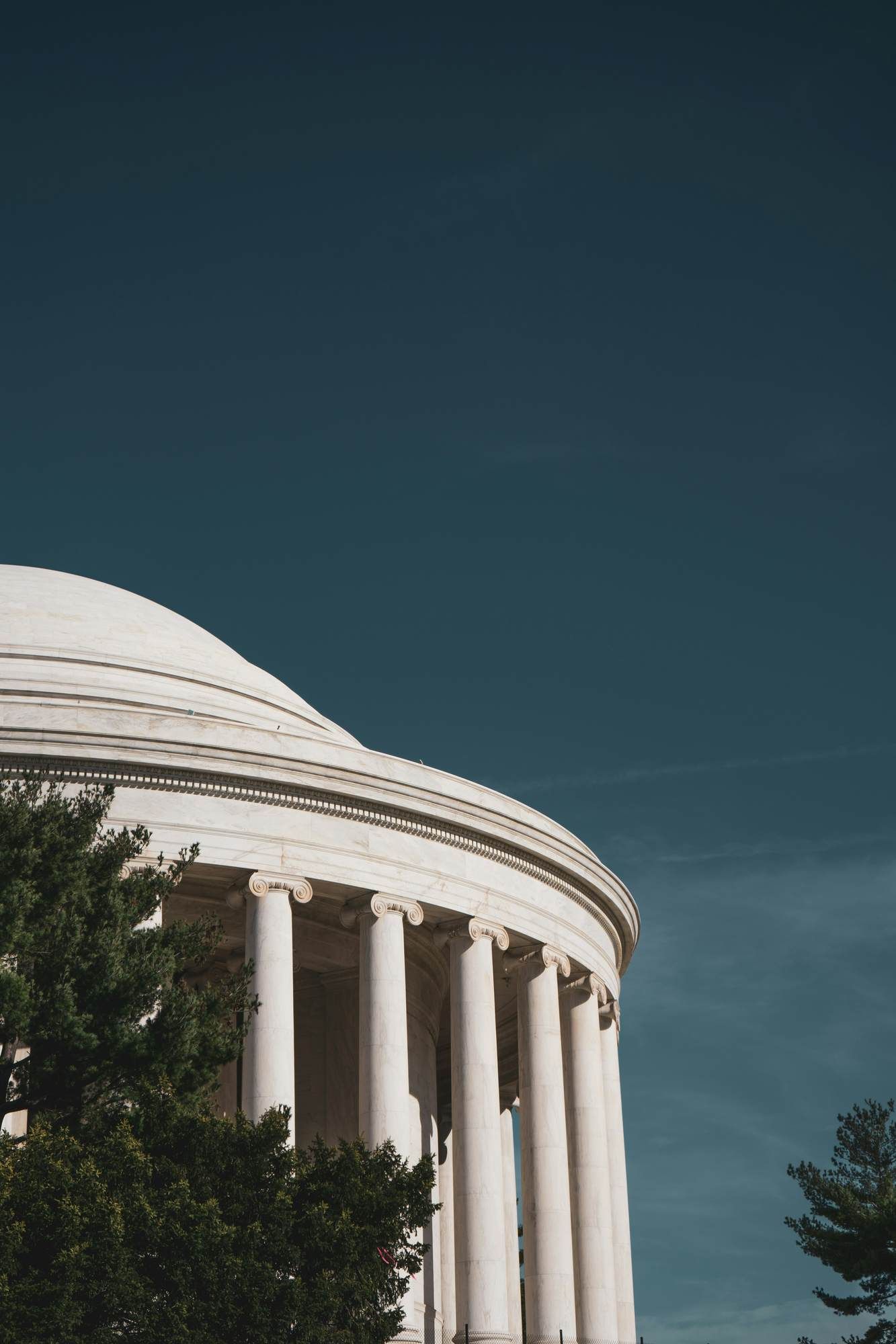 Historic domed building with tall white columns near VERVE Charlottesville.