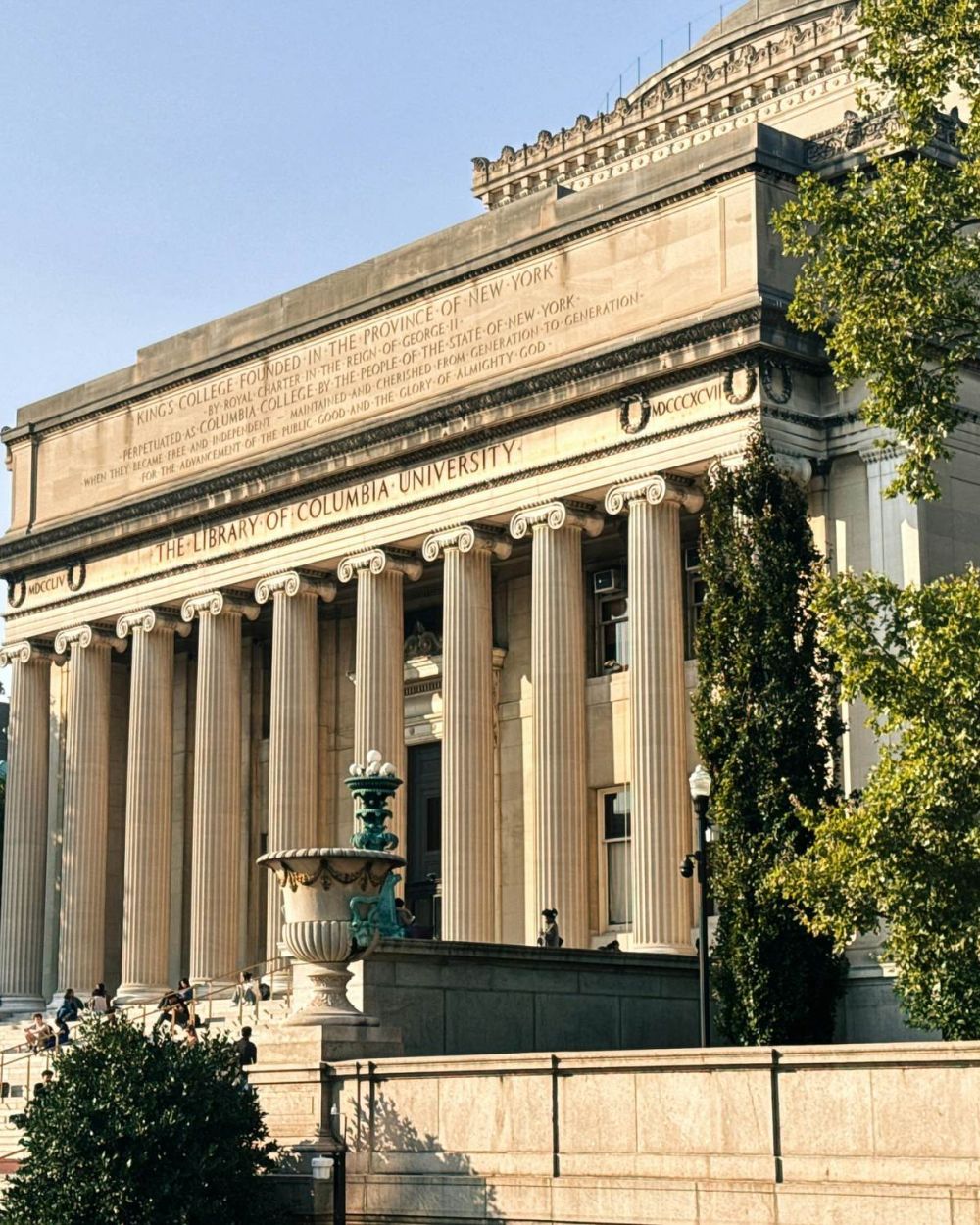 VERVE Charlottesville girl sitting in car smiling while taking a bit of pizza