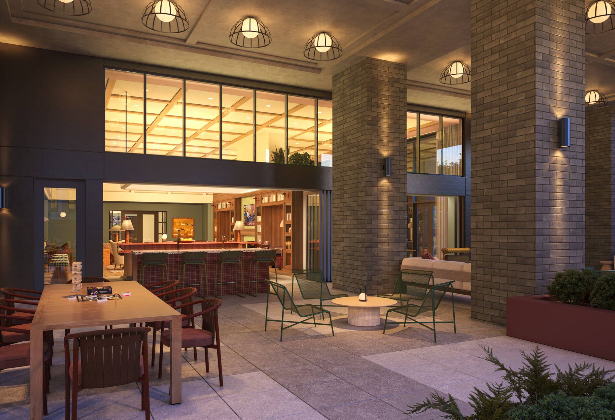 Outdoor patio with dining table, bar area visible through windows, and lounge seating.